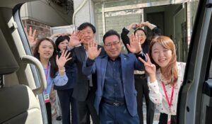 Members of the Busan Metropolitan Volunteer Center and hosts for the 2024 World Volunteer Conference wave good-bye after a recent visit.