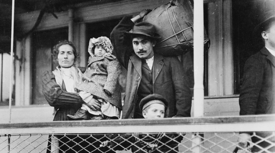 An immigrant family leaves Ellis Island, U.S., in 1905