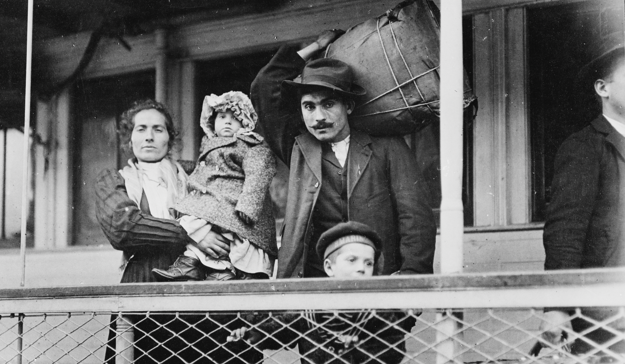 An immigrant family leaves Ellis Island, U.S., in 1905